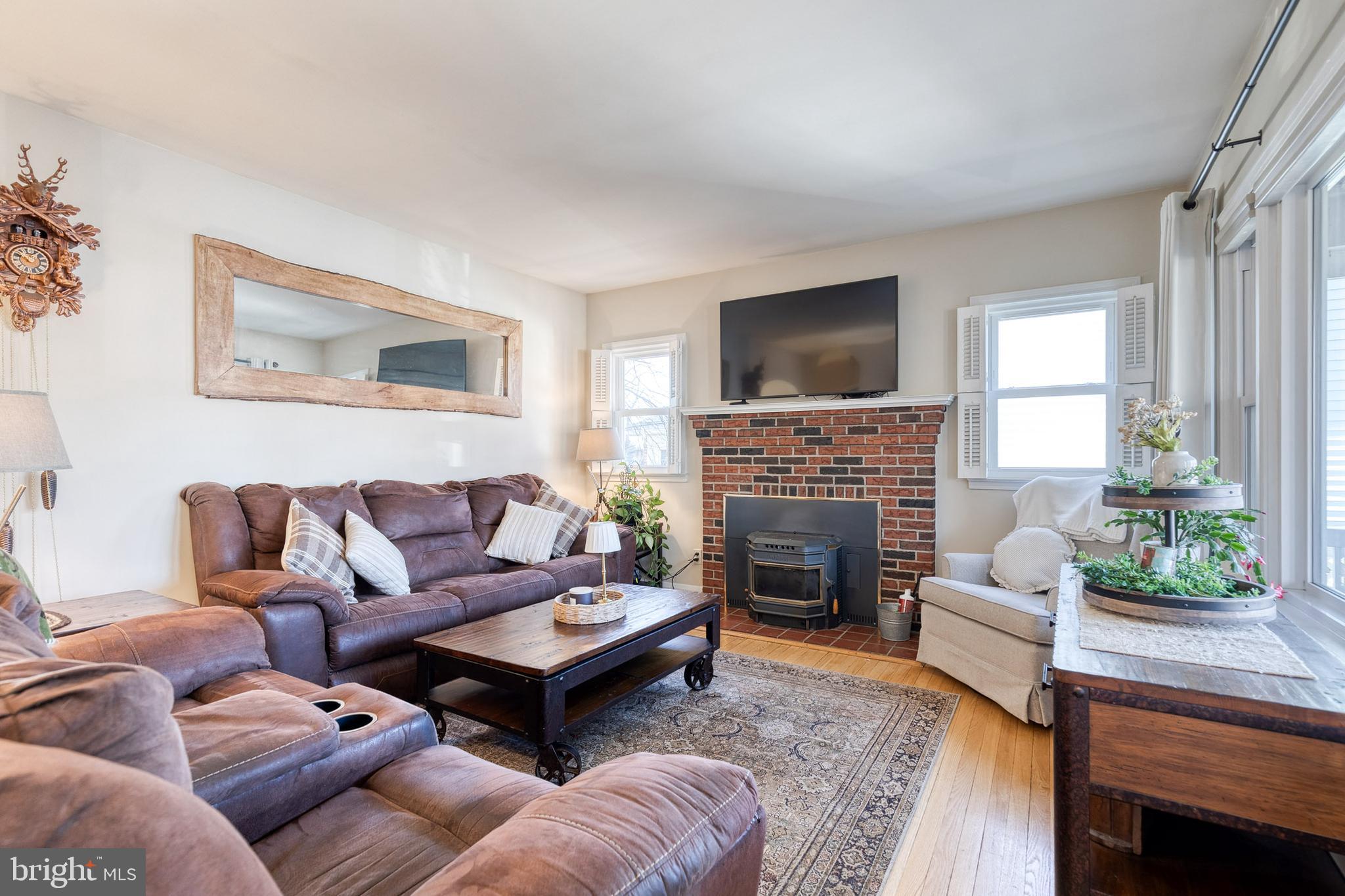1911 Sunberry Road Dundalk, MD 21222 - Photo 7 of 38 a living room with furniture a fireplace and a flat screen tv