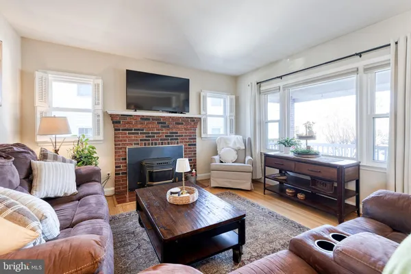 a living room with furniture fireplace and a flat screen tv