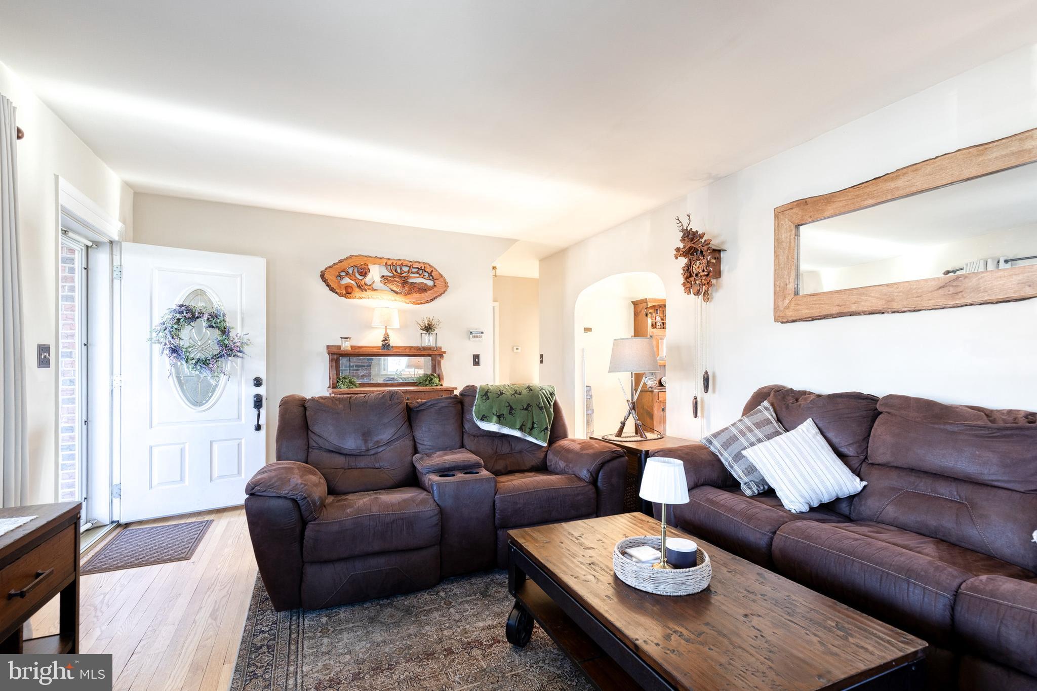 1911 Sunberry Road Dundalk, MD 21222 - Photo 9 of 38 a living room with furniture and painting on the wall