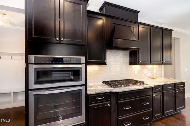 a large kitchen with stainless steel appliances granite countertop plenty of counter space