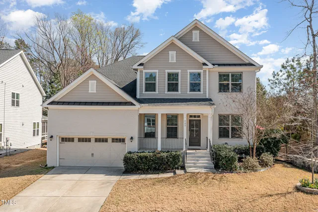a aerial view of a house with yard and sitting area