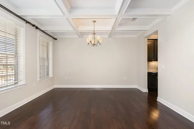 a picture of a bench in front of a white house