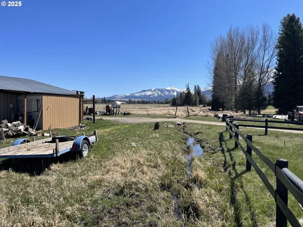 a view of a swimming pool and lounge chairs