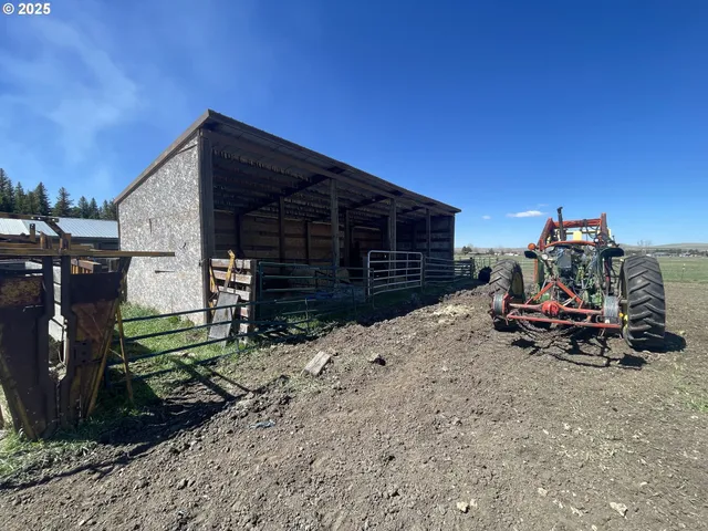a view of a wooden house with a yard