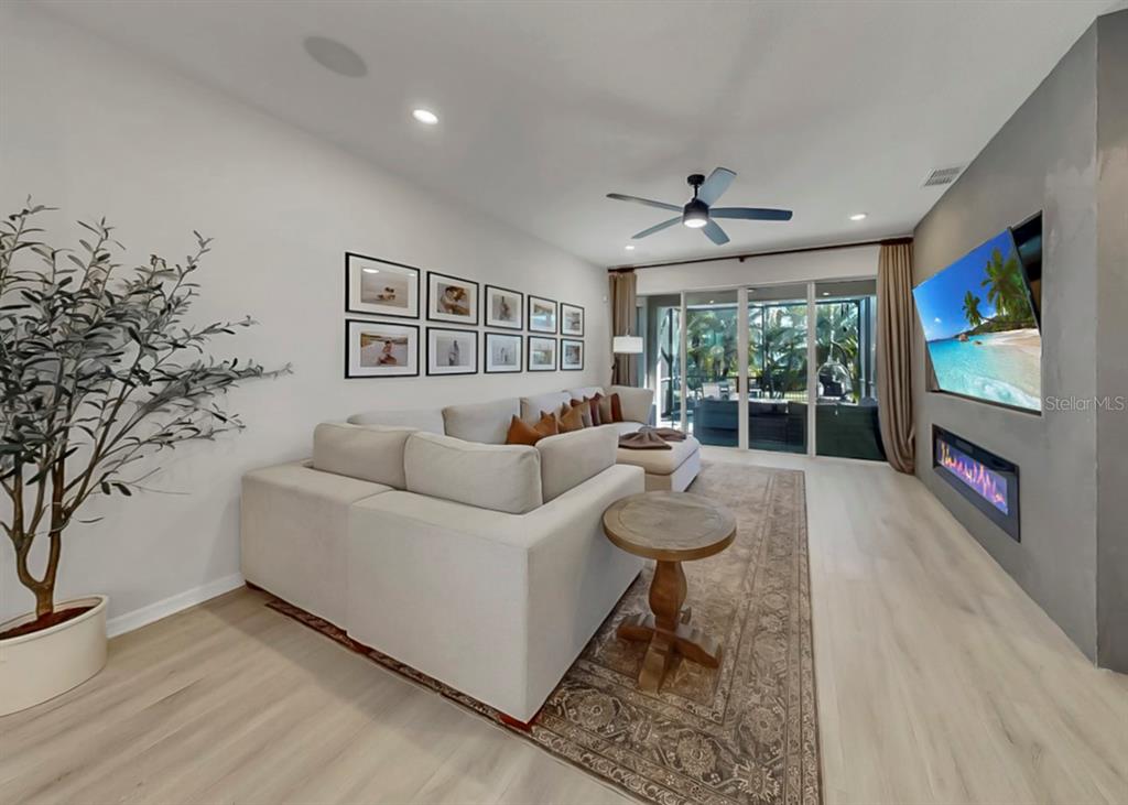 7206 Paradiso Drive Apollo Beach, FL 33572 - Photo 20 of 44 a living room with furniture and a flat screen tv