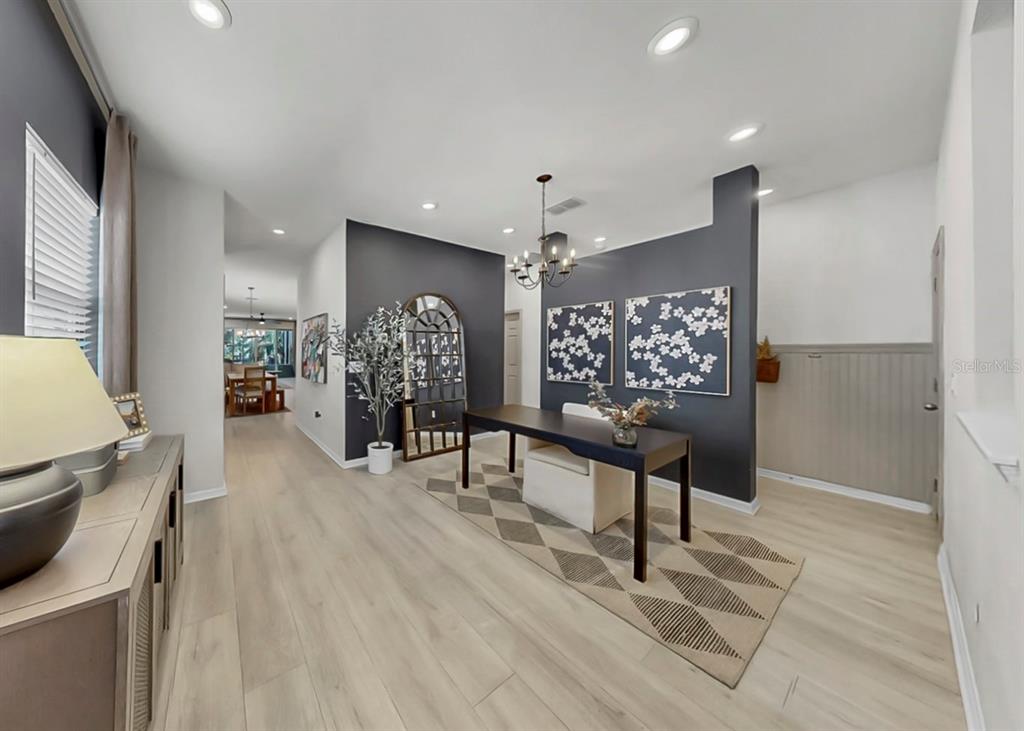 7206 Paradiso Drive Apollo Beach, FL 33572 - Photo 21 of 44 a living room with furniture and a wooden floor