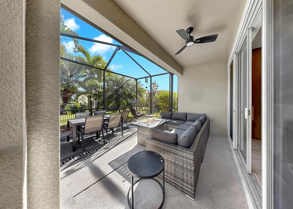 7206 Paradiso Drive Apollo Beach, FL 33572 - Photo 22 of 44 a living room with furniture and a floor to ceiling window