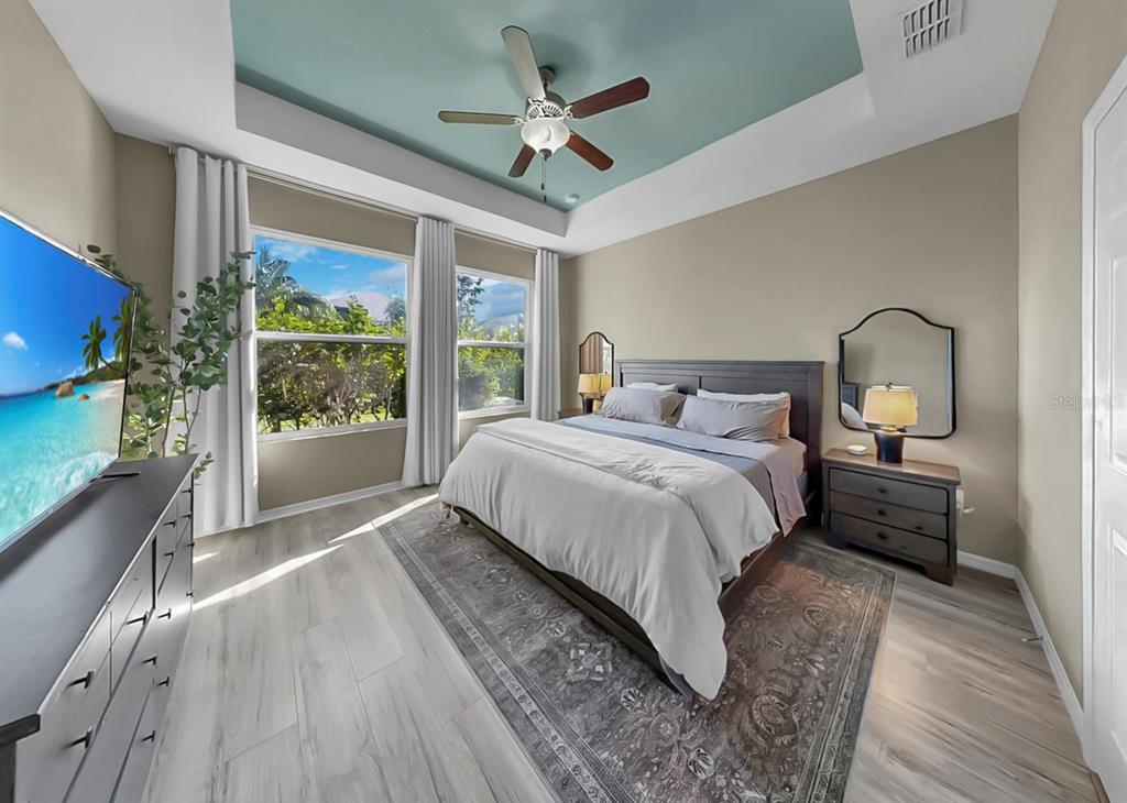 7206 Paradiso Drive Apollo Beach, FL 33572 - Photo 25 of 44 a bedroom with a large bed and a large window