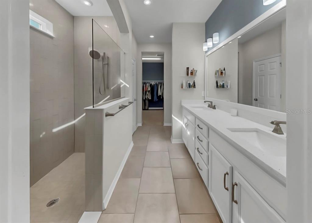 7206 Paradiso Drive Apollo Beach, FL 33572 - Photo 28 of 44 a large white kitchen with a large window