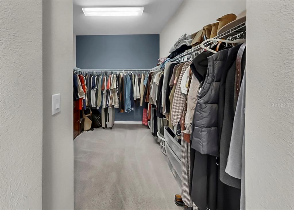 7206 Paradiso Drive Apollo Beach, FL 33572 - Photo 30 of 44 a view of walk in closet with clothes and shoes