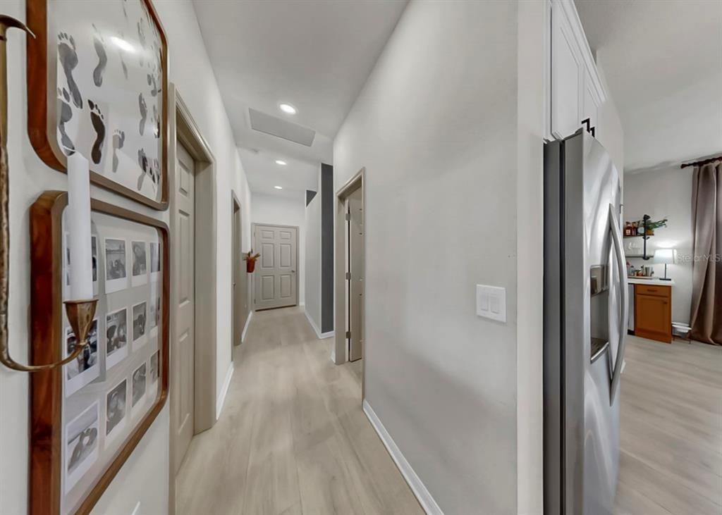 7206 Paradiso Drive Apollo Beach, FL 33572 - Photo 33 of 44 a view of a hallway with wooden shelves