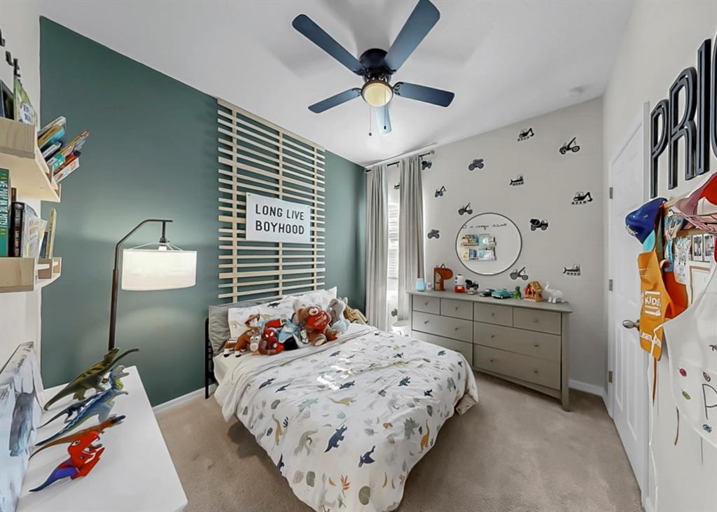 7206 Paradiso Drive Apollo Beach, FL 33572 - Photo 34 of 44 a bedroom with a bed and a chandelier