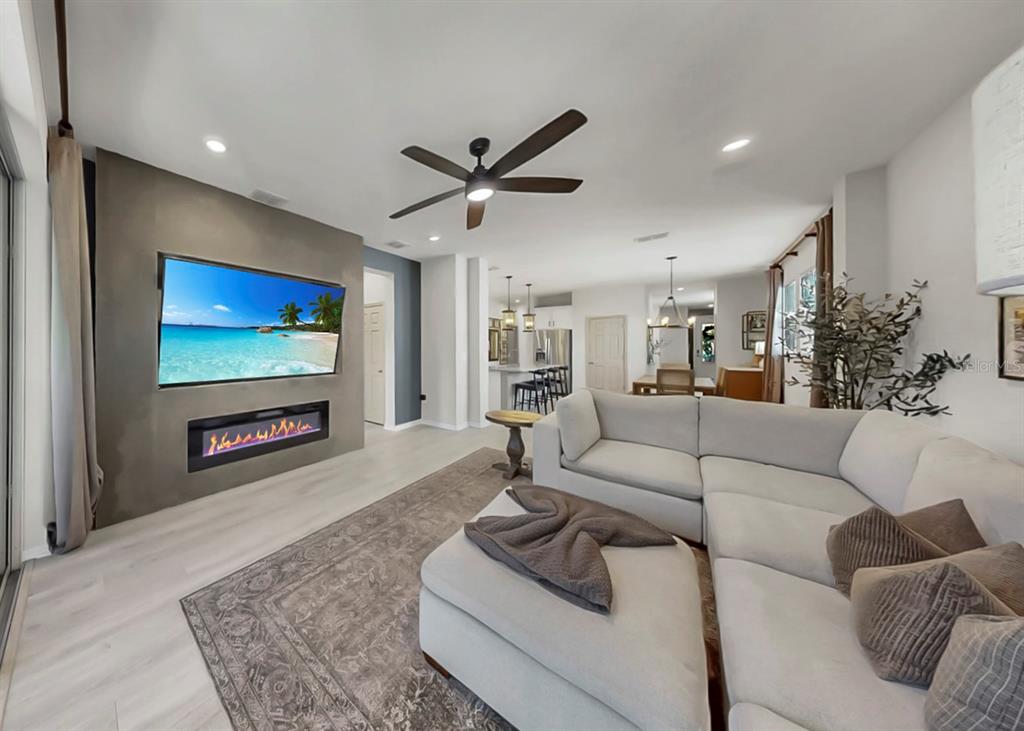 7206 Paradiso Drive Apollo Beach, FL 33572 - Photo 4 of 44 a living room with furniture and a flat screen tv