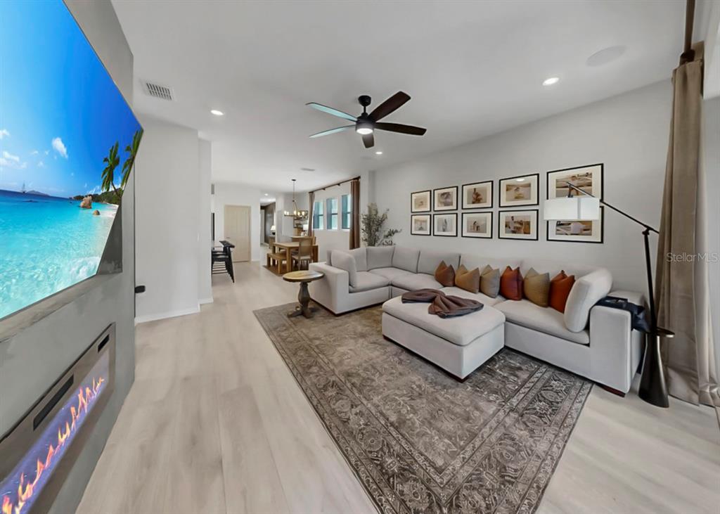7206 Paradiso Drive Apollo Beach, FL 33572 - Photo 5 of 44 a living room with furniture and a fireplace