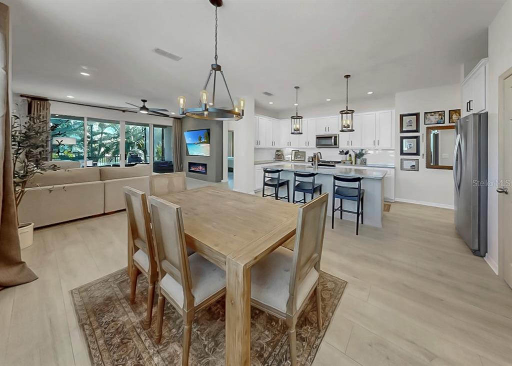 7206 Paradiso Drive Apollo Beach, FL 33572 - Photo 9 of 44 a view of a dining room with furniture window and wooden floor