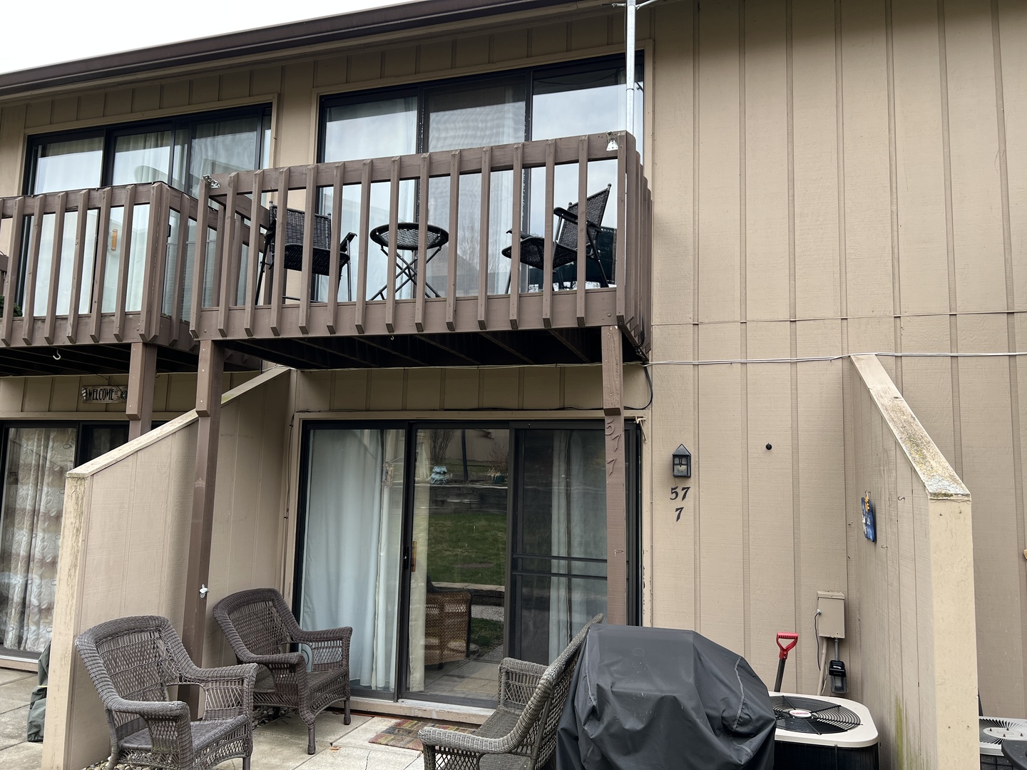 a front view of a house with outdoor seating