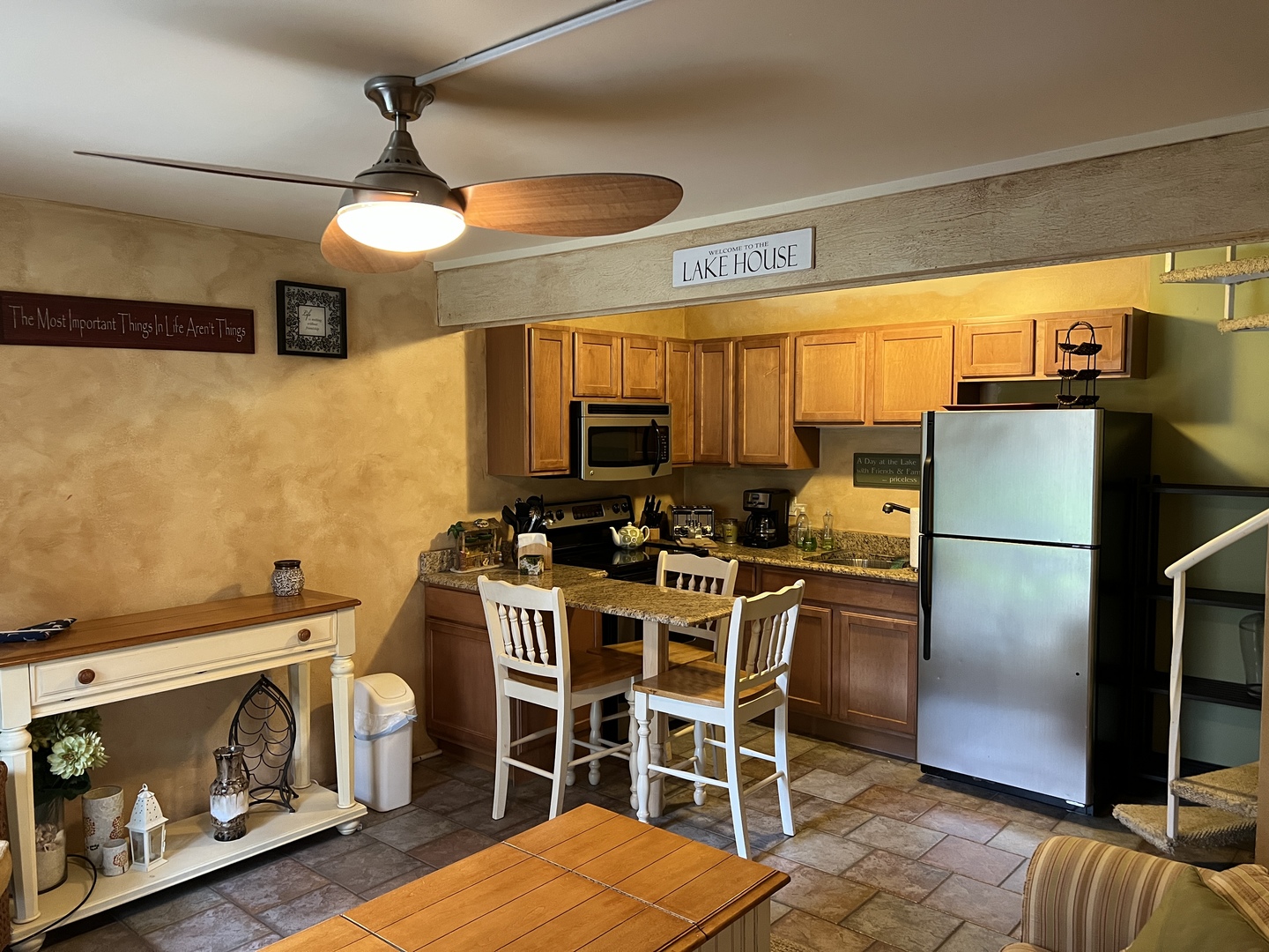 57 Vail Colony, Unit 7 Fox Lake, IL 60020 - Photo 15 of 25 a view of a kitchen with stainless steel appliances wooden floor and furniture