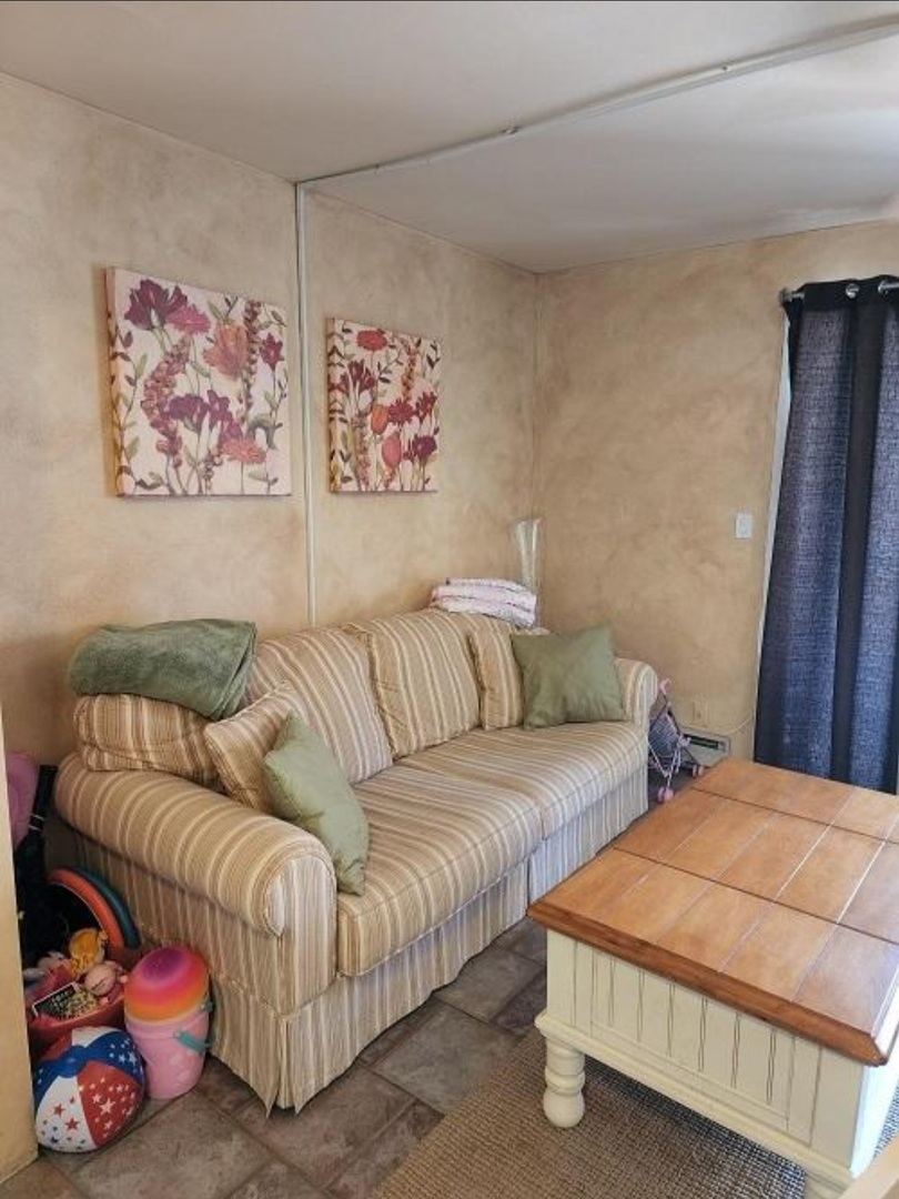 57 Vail Colony, Unit 7 Fox Lake, IL 60020 - Photo 18 of 25 a bedroom with furniture and a couch