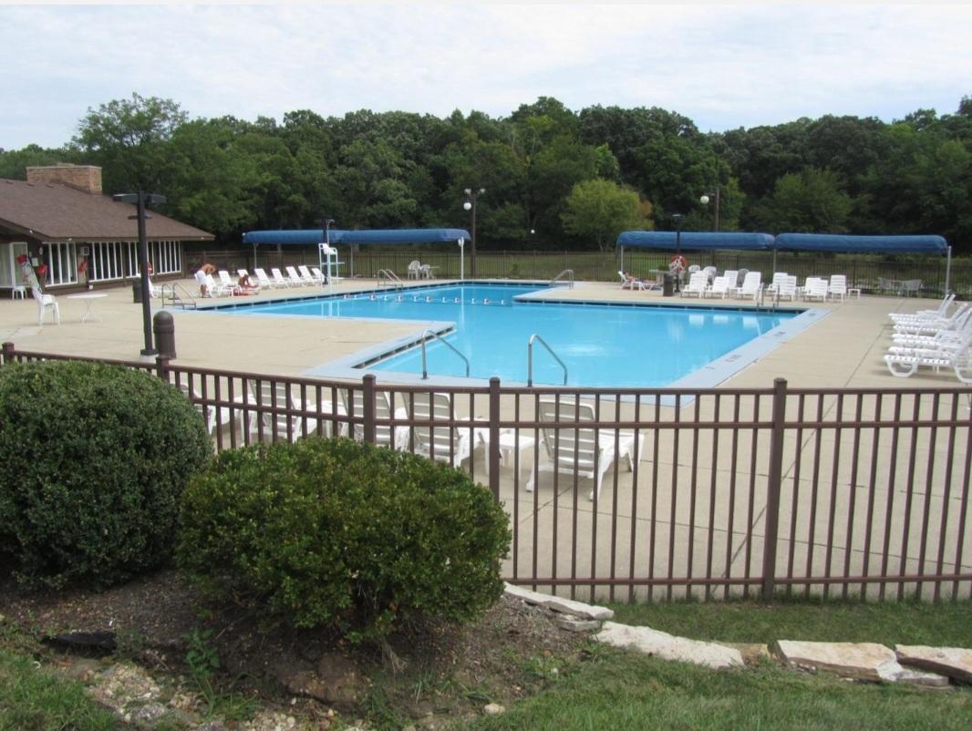 57 Vail Colony, Unit 7 Fox Lake, IL 60020 - Photo 2 of 25 a view of swimming pool with deck