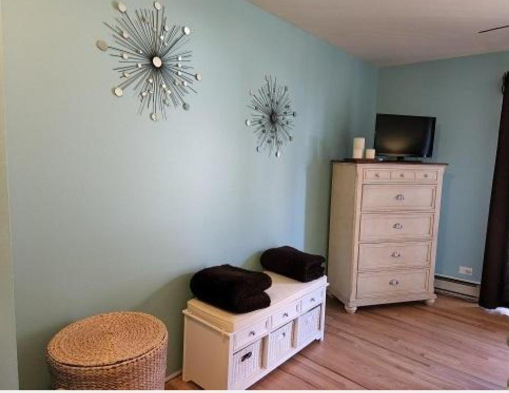 57 Vail Colony, Unit 7 Fox Lake, IL 60020 - Photo 21 of 25 a living room with furniture and a flat screen tv