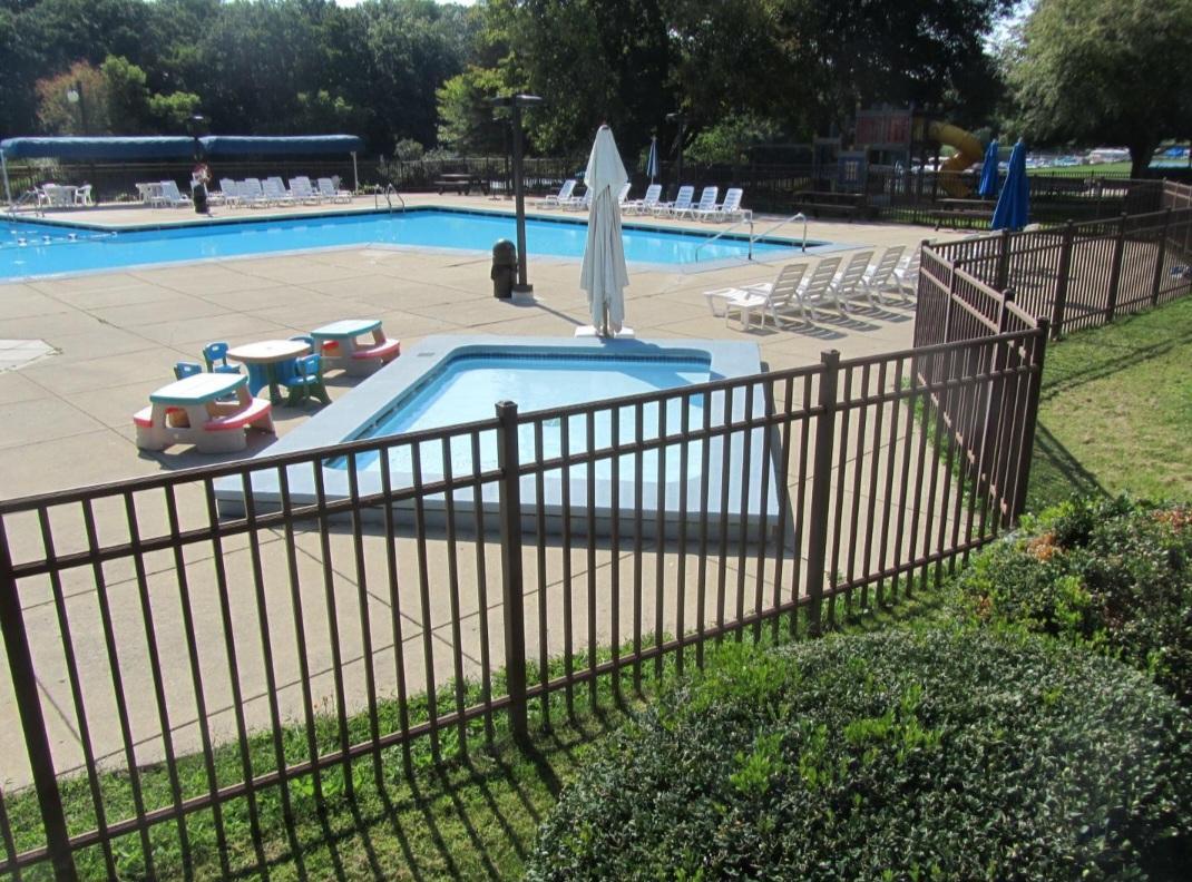 57 Vail Colony, Unit 7 Fox Lake, IL 60020 - Photo 3 of 25 a view of a swimming pool with a patio and lake view