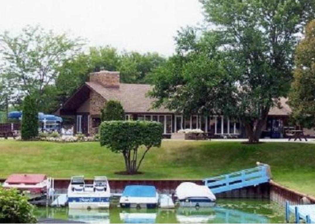 57 Vail Colony, Unit 7 Fox Lake, IL 60020 - Photo 4 of 25 front view of house with a yard