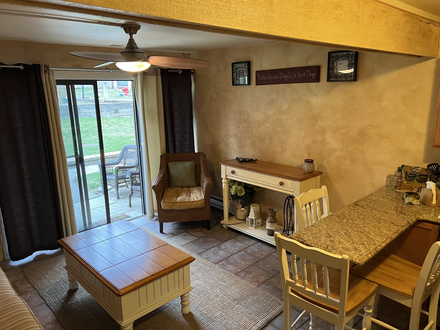 57 Vail Colony, Unit 7 Fox Lake, IL 60020 - Photo 5 of 25 a living room with a baby crib furniture and a fireplace
