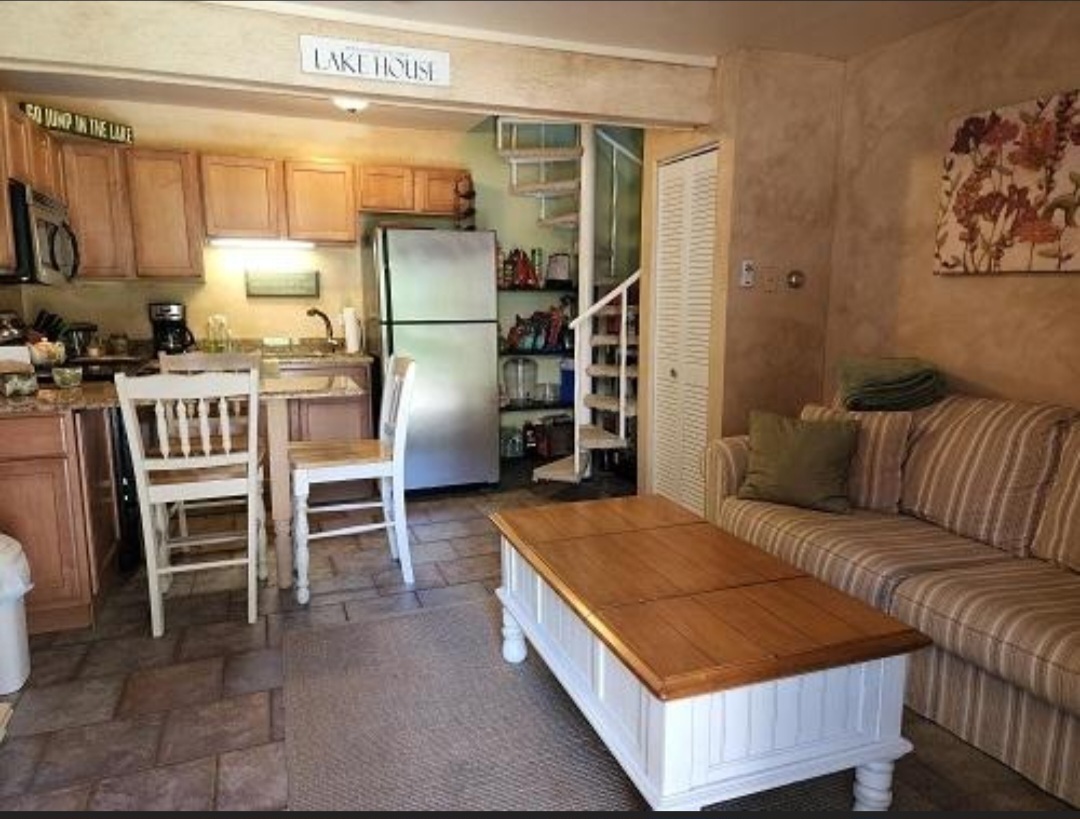 57 Vail Colony, Unit 7 Fox Lake, IL 60020 - Photo 8 of 25 a bed room with a bed and chair