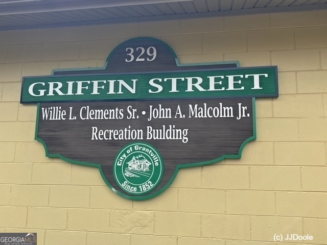 21 Smith Street Grantville, GA 30220 - Photo 13 of 72 a close up of a sign on a brick wall