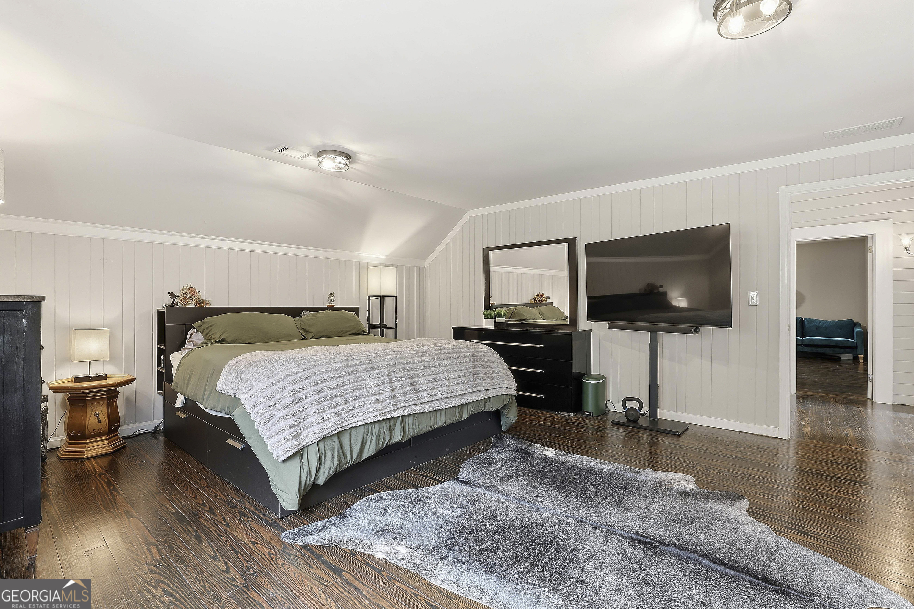 21 Smith Street Grantville, GA 30220 - Photo 59 of 72 a bedroom with a bed and a flat screen tv