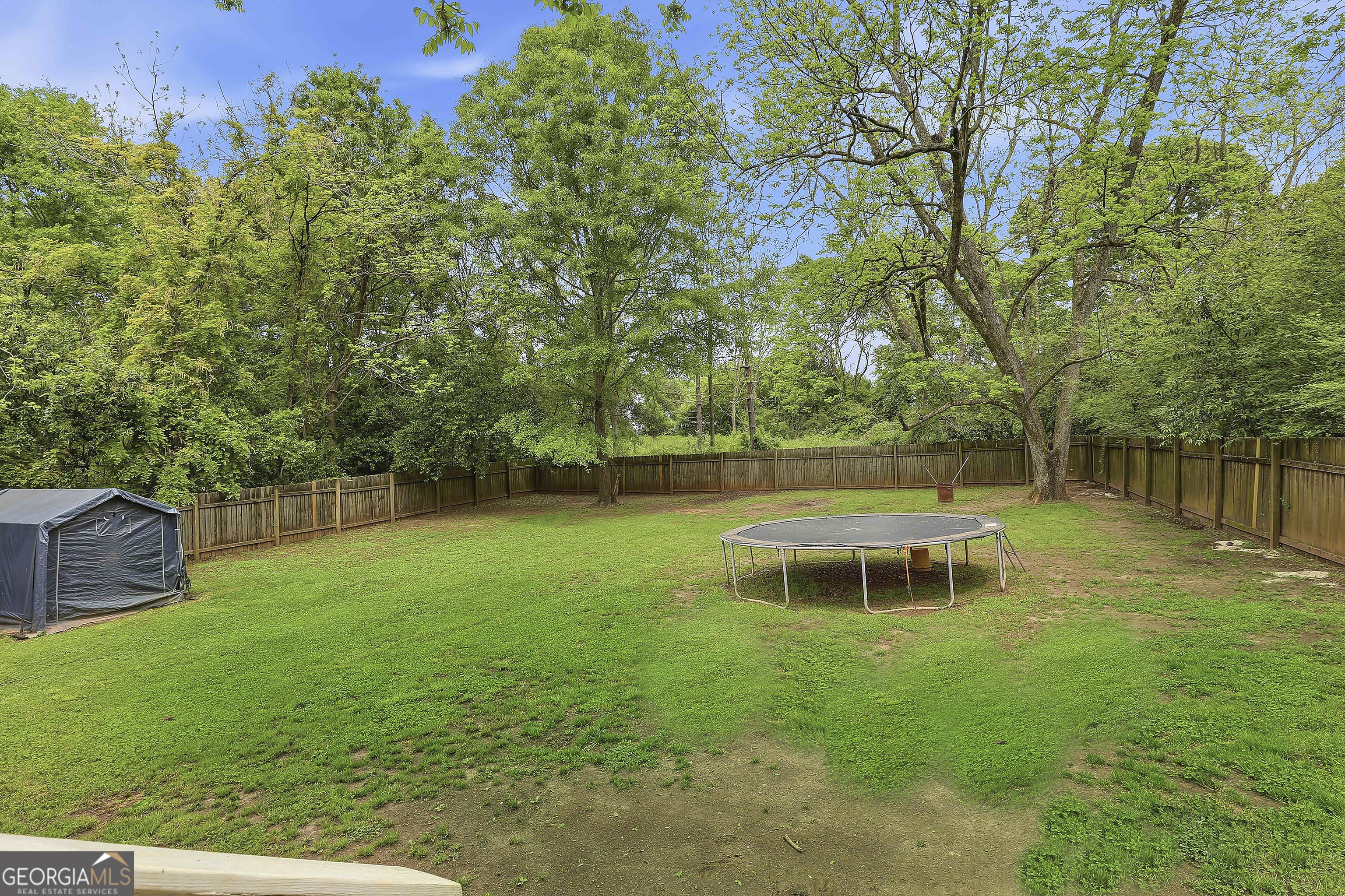 21 Smith Street Grantville, GA 30220 - Photo 67 of 72 a view of a backyard with a garden and entertaining space