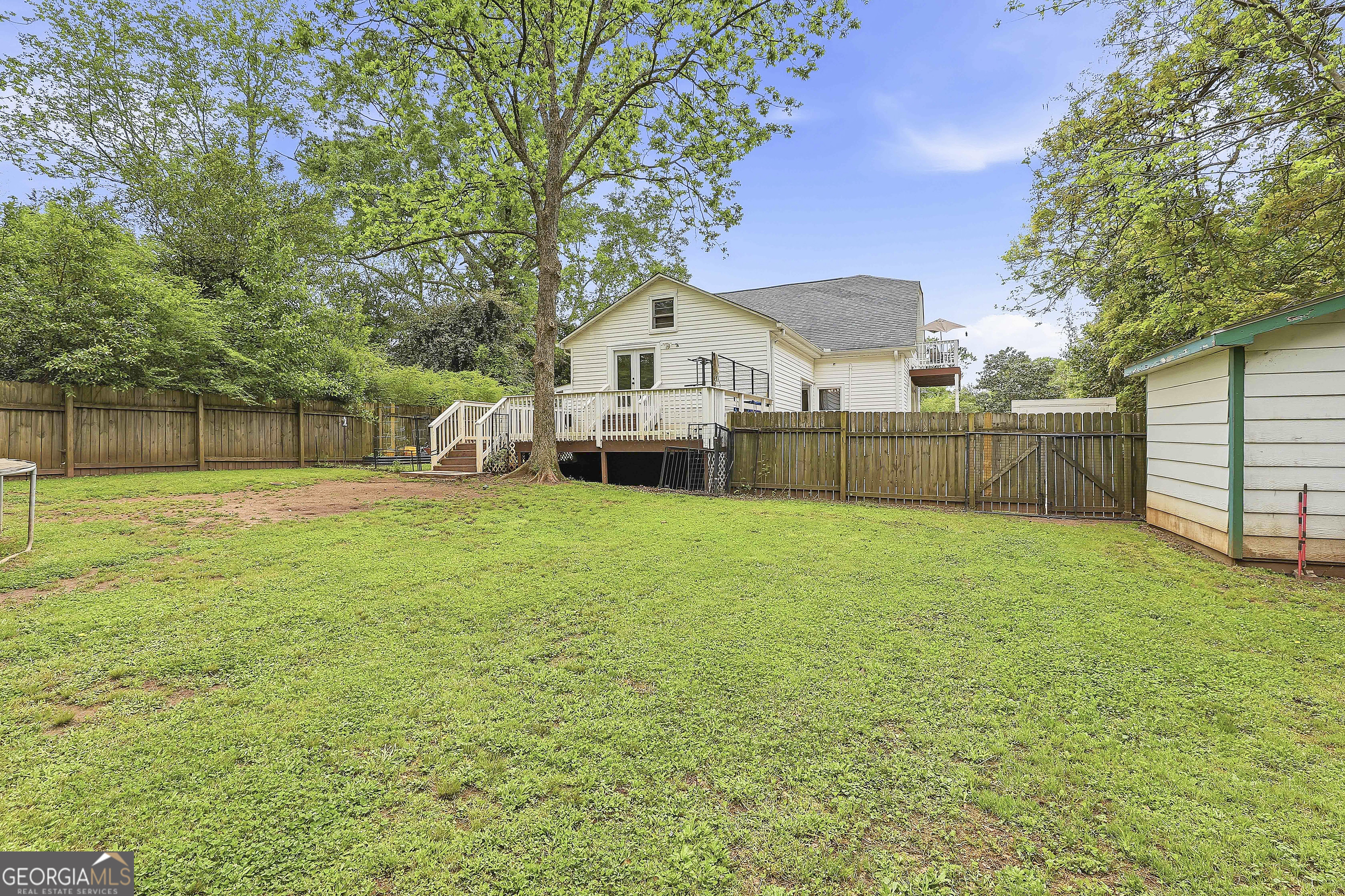 21 Smith Street Grantville, GA 30220 - Photo 69 of 72 a view of a house with a big yard and large tree