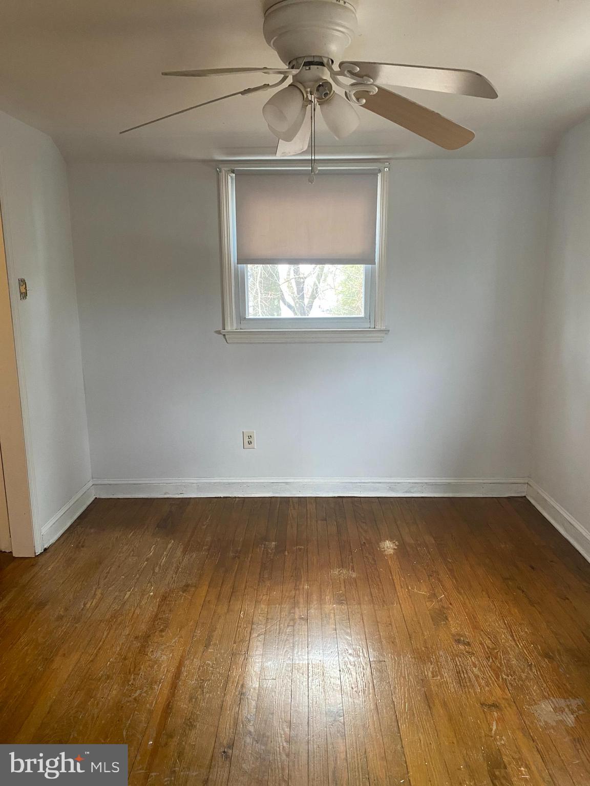 459 Scotch Road Titusville, NJ 08560 - Photo 13 of 16 an empty room with wooden floor and windows