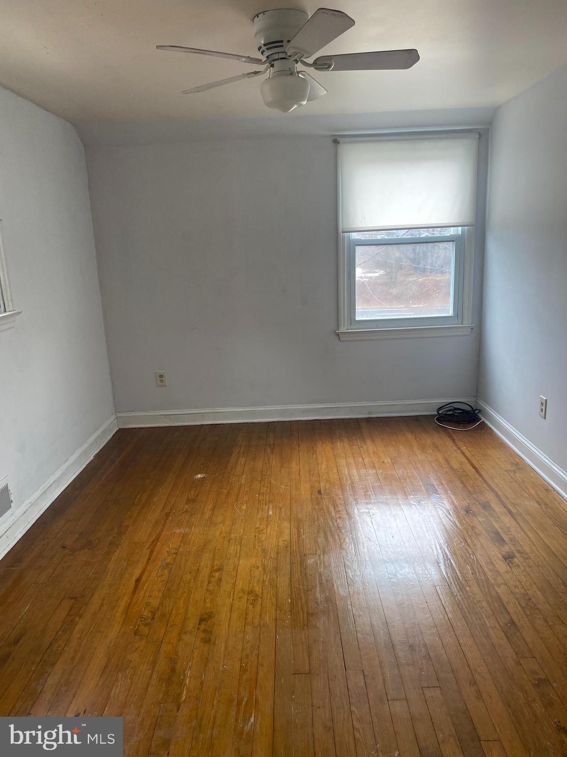 459 Scotch Road Titusville, NJ 08560 - Photo 14 of 16 an empty room with wooden floor and windows
