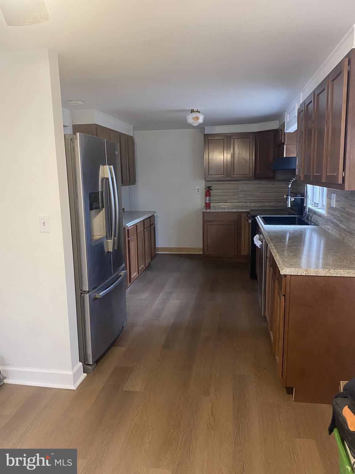459 Scotch Road Titusville, NJ 08560 - Photo 2 of 16 a kitchen with refrigerator a microwave a sink and dishwasher