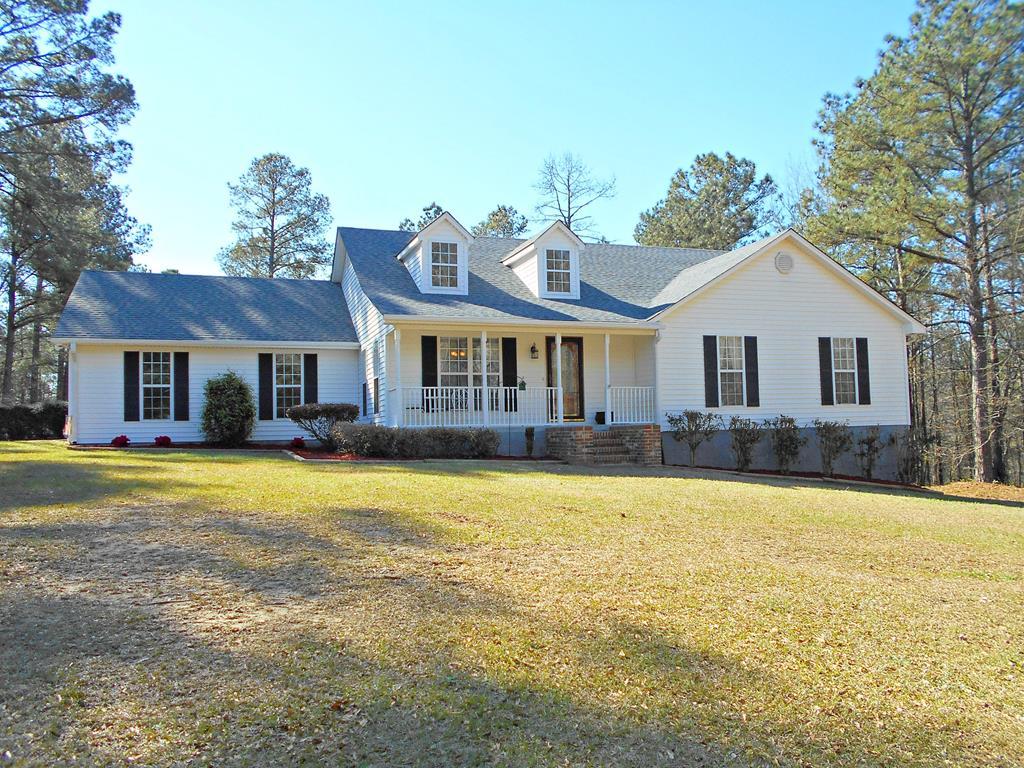 1135 Taylor Road Juliette, GA 31046 - Photo 1 of 12 a front view of a house with swimming pool having outdoor seating