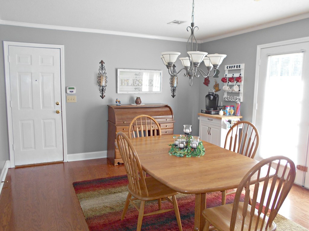 1135 Taylor Road Juliette, GA 31046 - Photo 4 of 12 a view of a dining room with furniture window and wooden floor