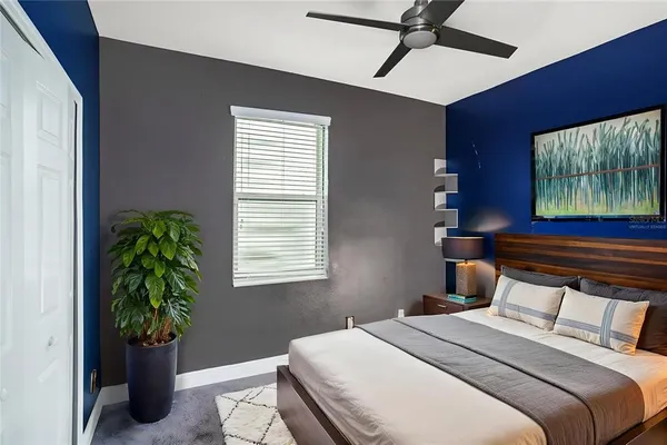 a bedroom with bed and a window