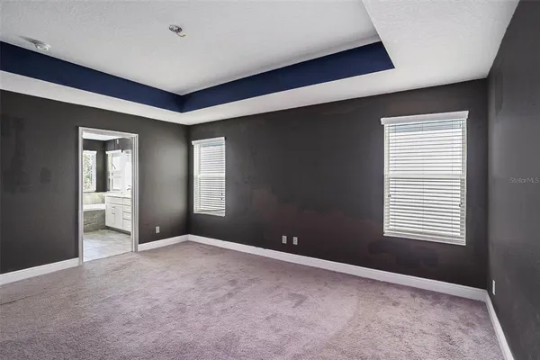 a view of empty room with windows
