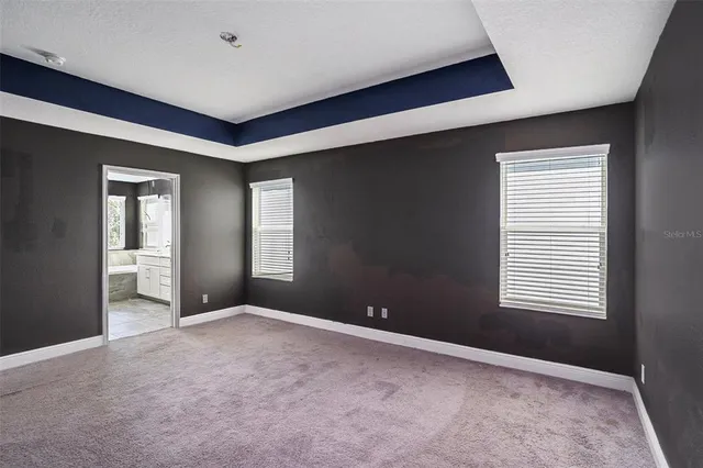 a view of empty room with windows