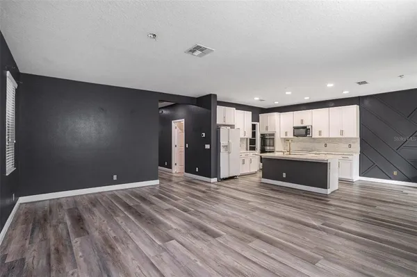 a view of kitchen and kitchen with a sink