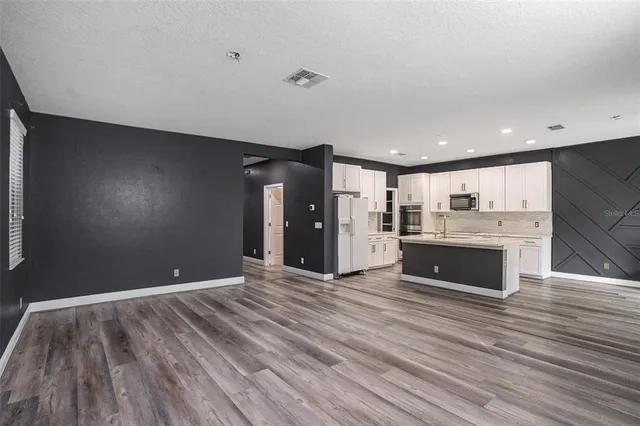a view of kitchen and kitchen with a sink