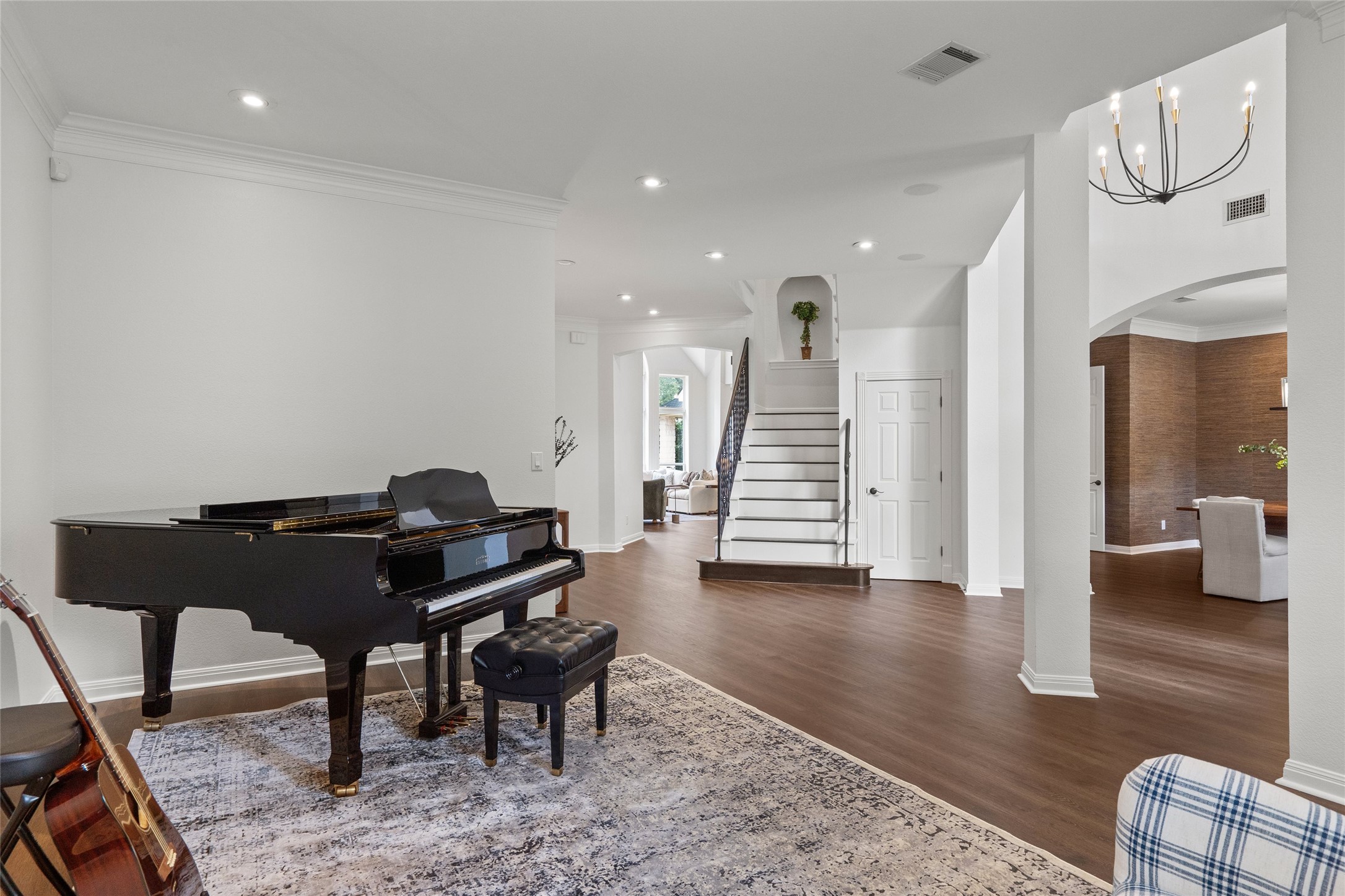 4313 Rio Robles Drive Austin, TX 78746 - Photo 5 of 40 Grand foyer with dark wood flooring and a classic staircase, perfect for welcoming guests.