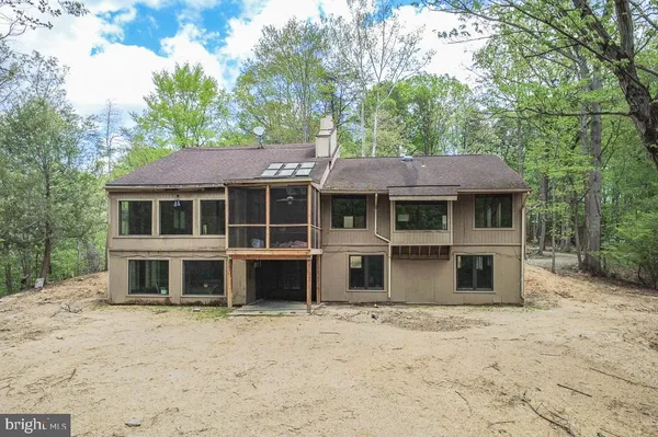 a house with trees in the background