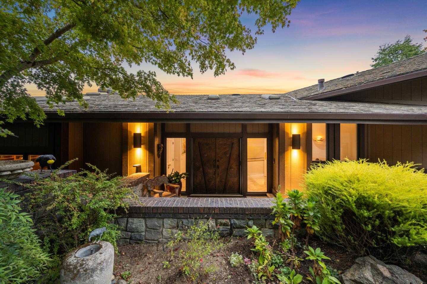 25 Preston Road Woodside, CA 94062 - Photo 2 of 71 a view of a house with potted plants and a large tree
