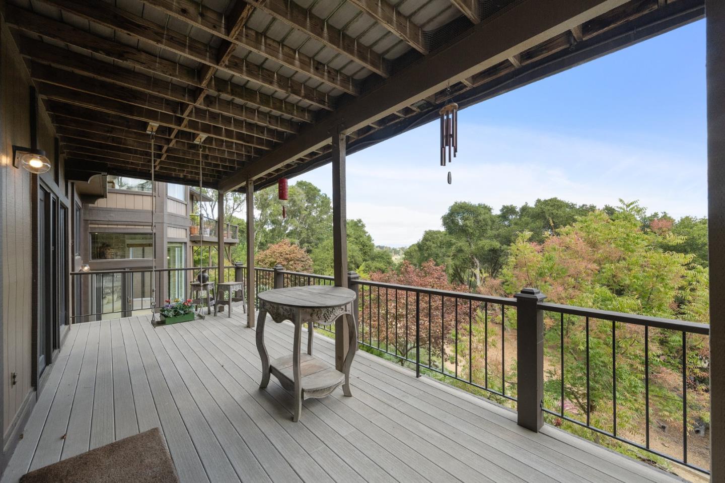25 Preston Road Woodside, CA 94062 - Photo 32 of 71 a view of a balcony with chairs and wooden floor