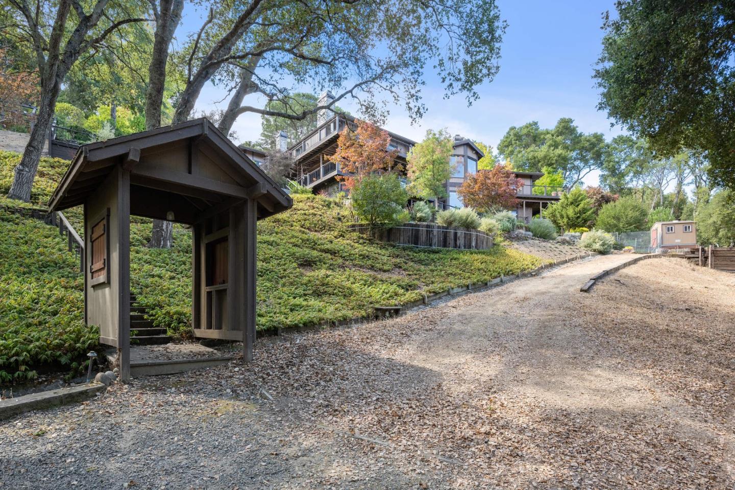 25 Preston Road Woodside, CA 94062 - Photo 57 of 71 a view of a house with a small yard and large trees