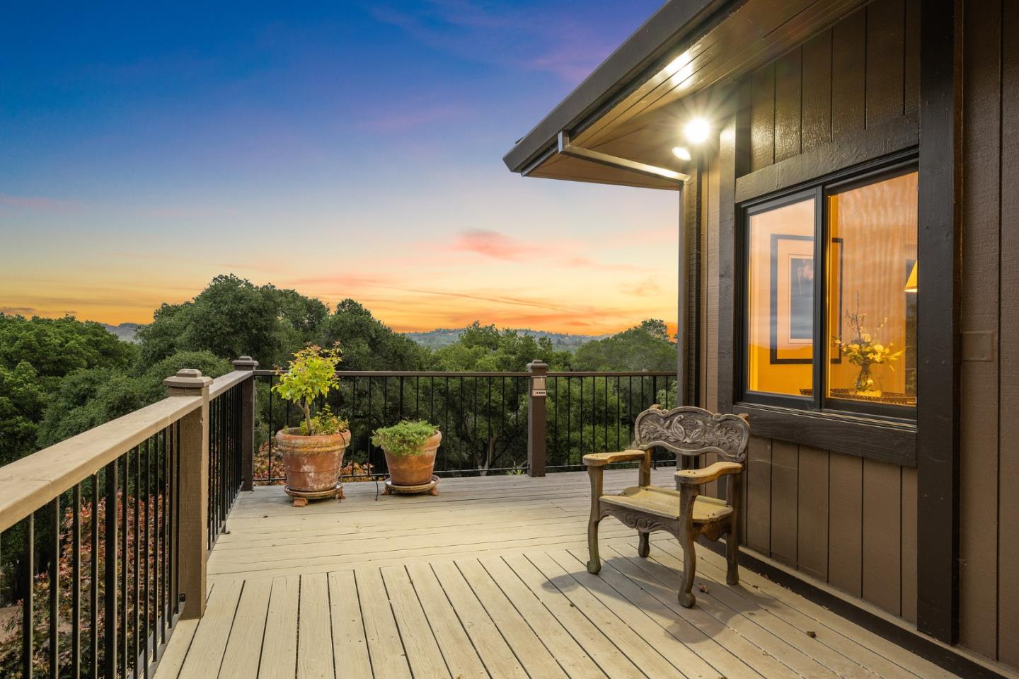 25 Preston Road Woodside, CA 94062 - Photo 62 of 71 a view of a balcony with couch and wooden floor