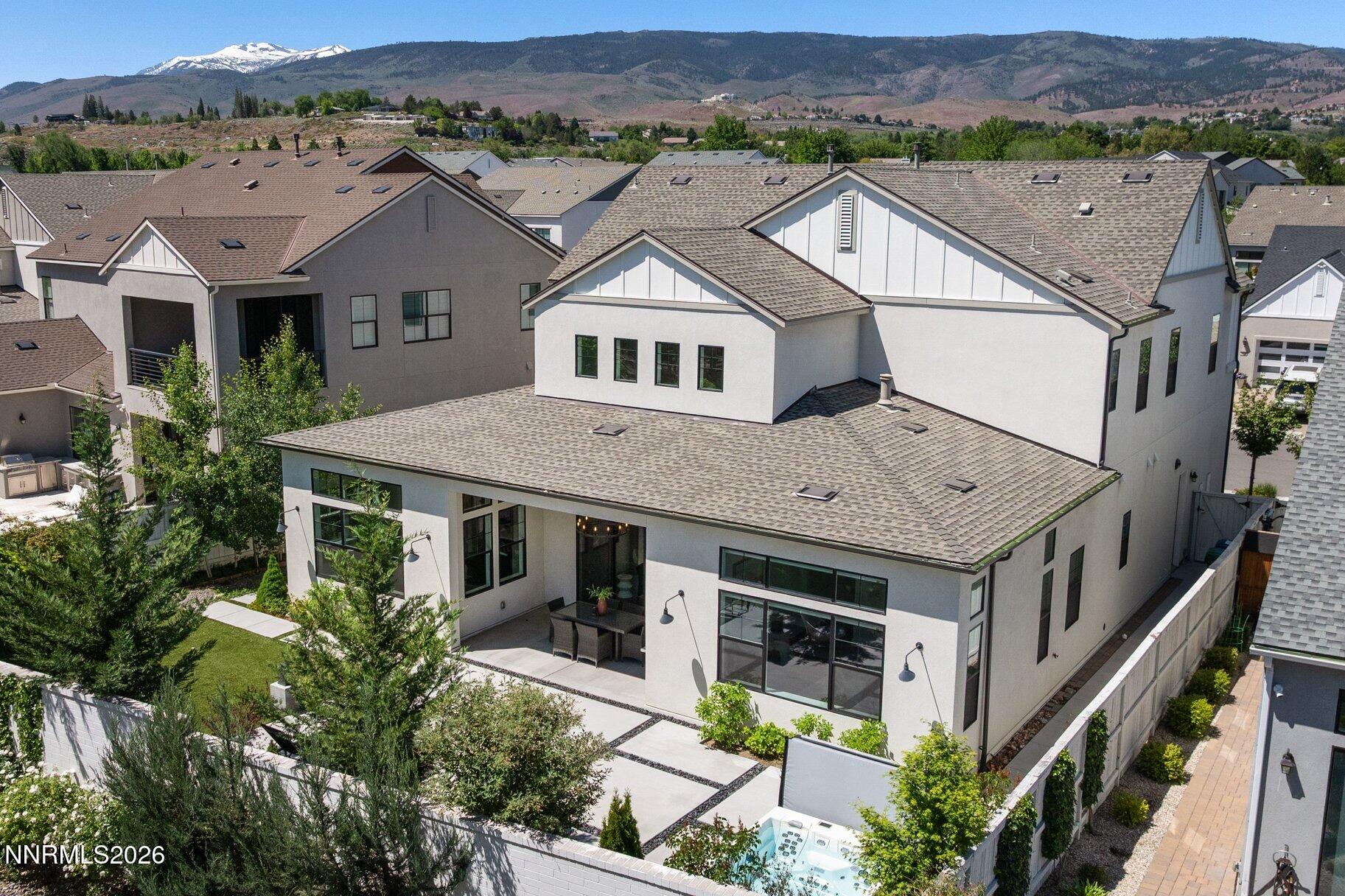 6110 South Pleasant Oak Trail Reno, NV 89511 - Photo 49 of 66 an aerial view of a house with a big yard and large tree