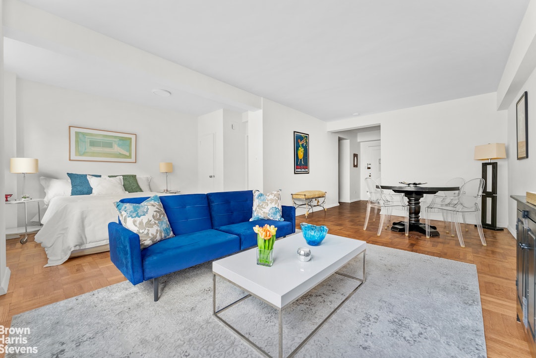 11 Riverside Drive, Unit 15OE Manhattan, NY 10023 - Photo 2 of 12 a living room with furniture and a table